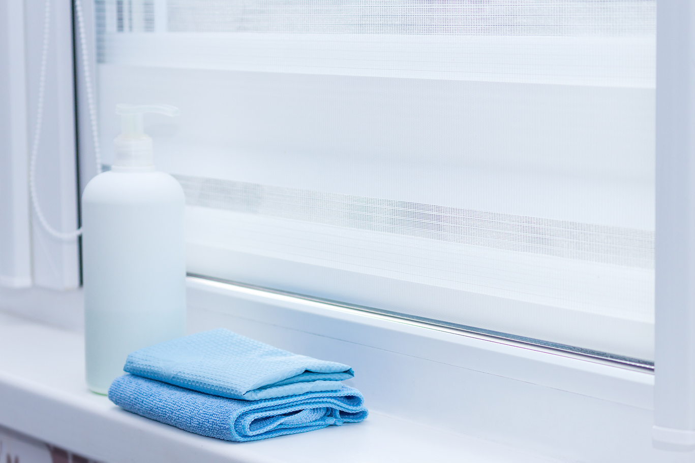 Roller blinds care, cleaning at home concept.